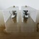 Pair of pull switch wall lights in perspex and gilded brass, France, circa 1960.