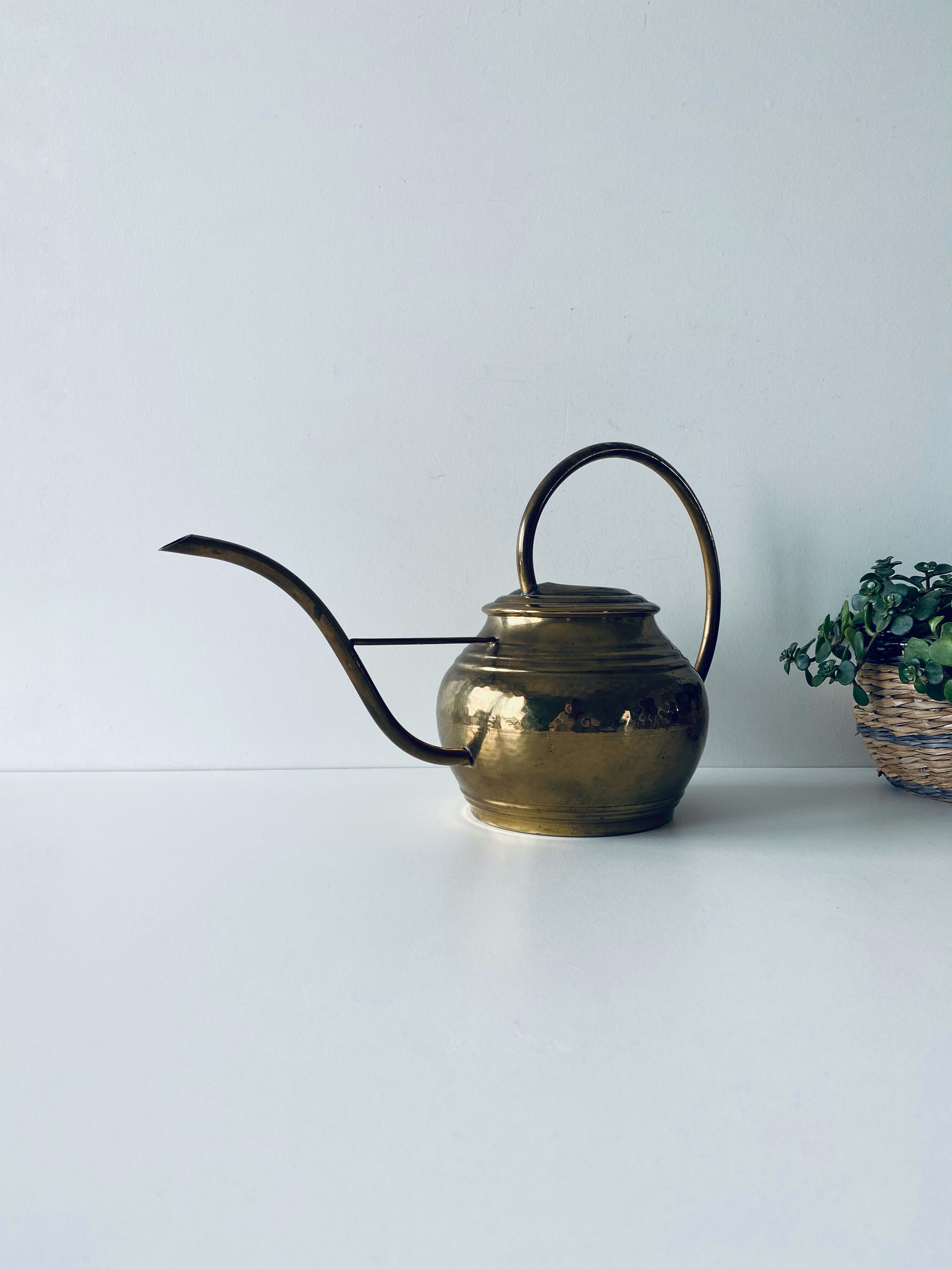 Old brass watering can