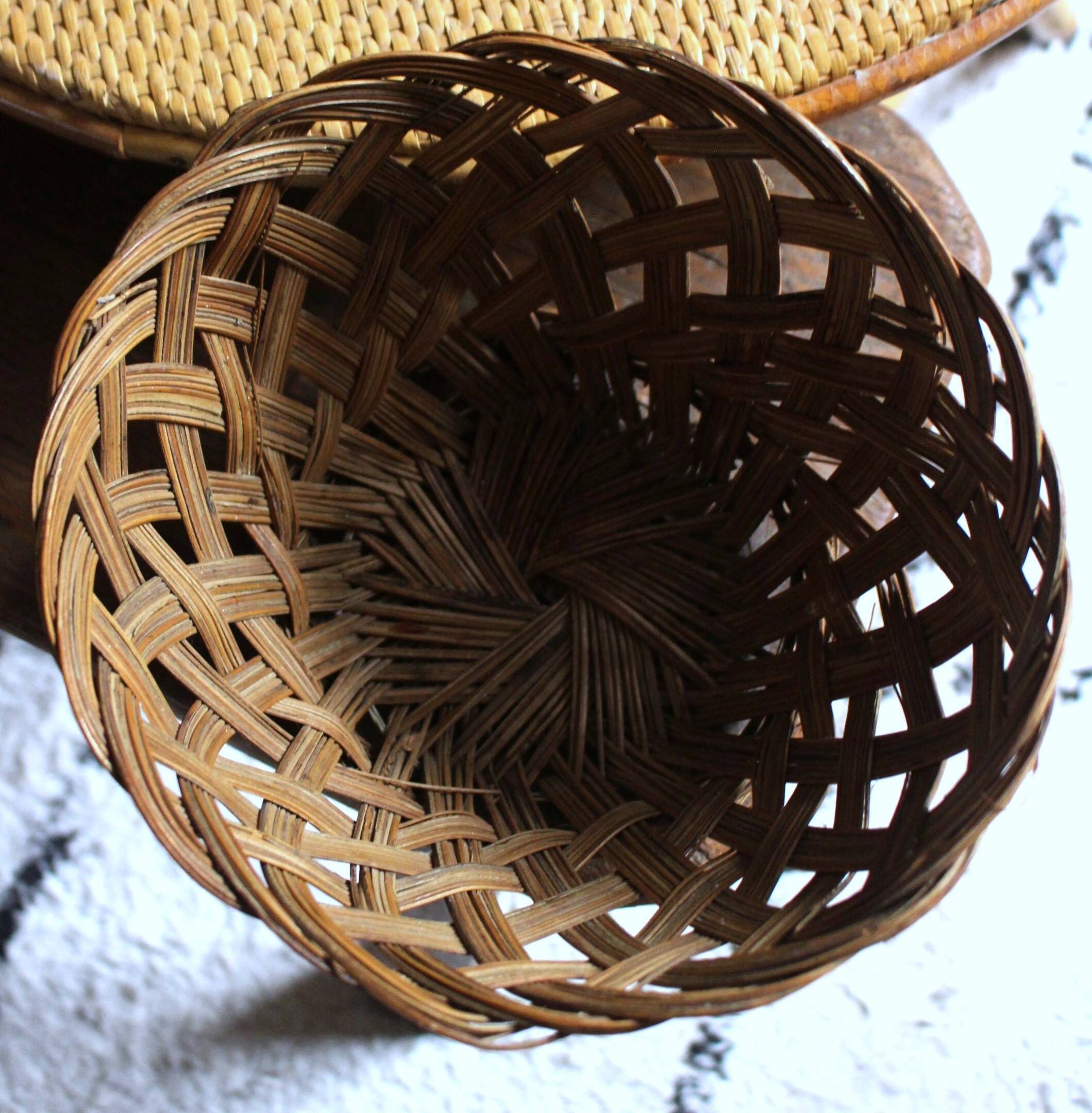 Vintage high round wicker basket with openwork.