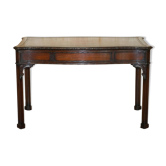 WARING & GILLOW library desk in the style of Thomas Chippendale with a leather top.