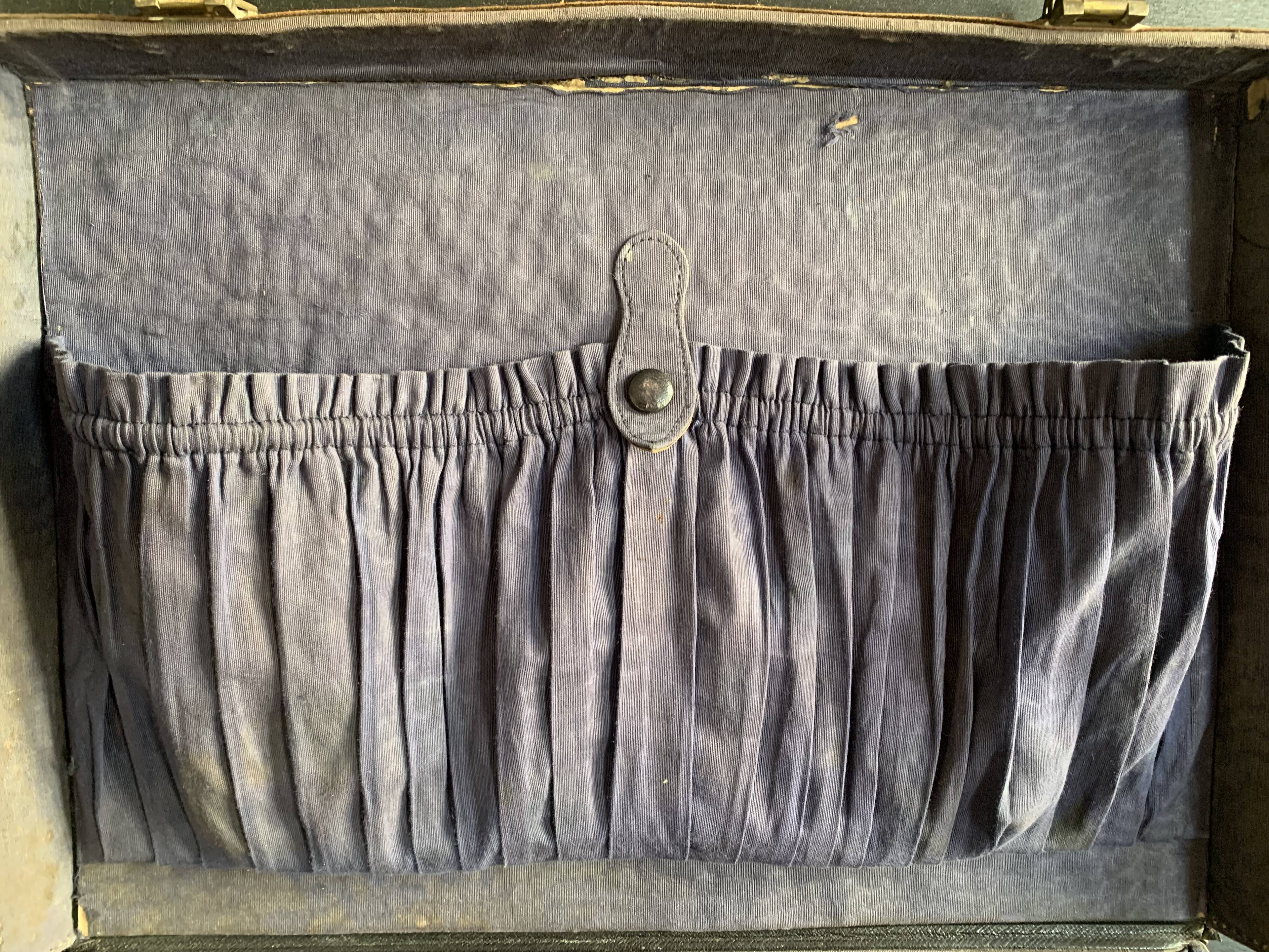 Small black grained leather travel suitcase from the 1920s