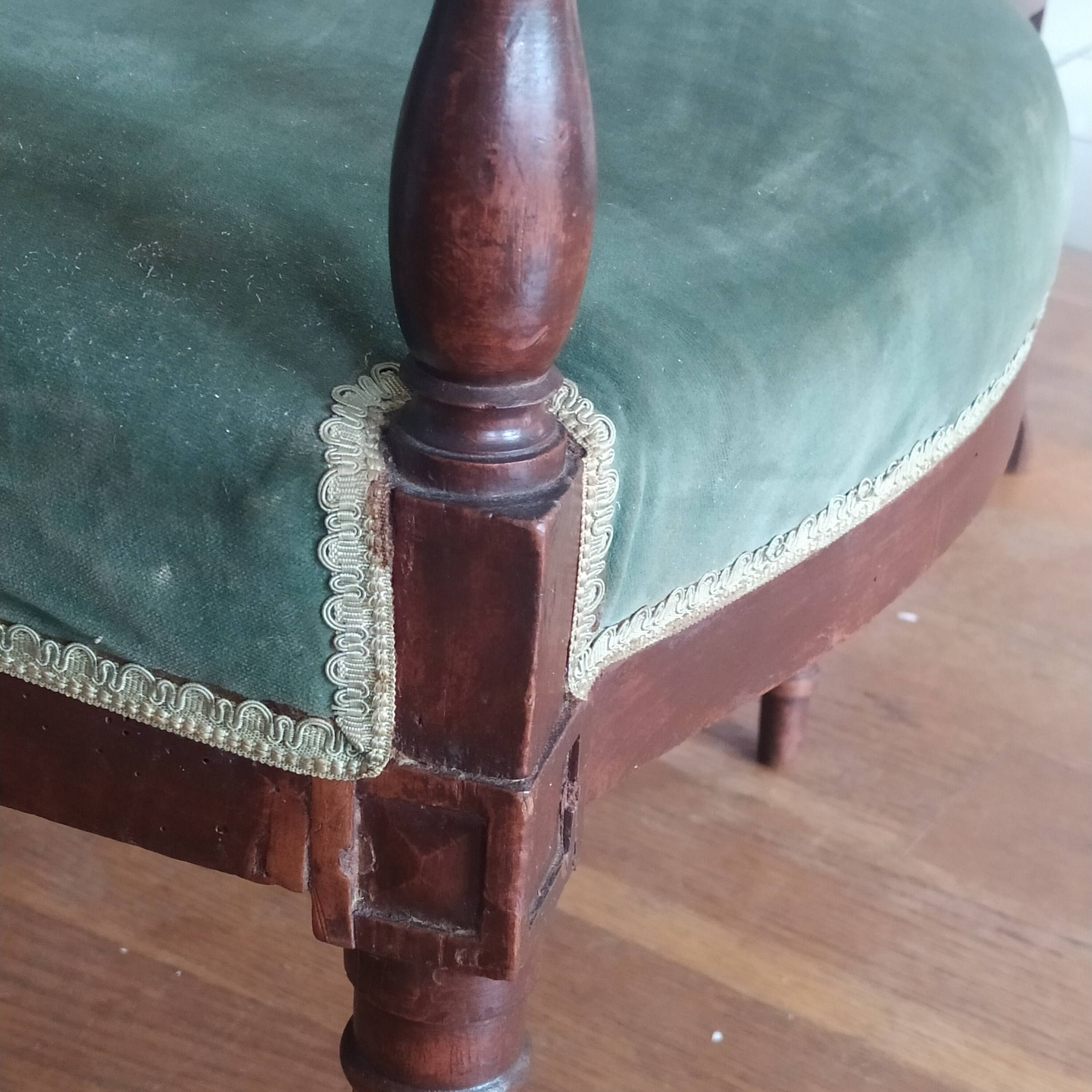 pair of Directoire armchairs in walnut, early 19th century, green velvet