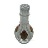 A liquor decanter has 4 compartments in glass