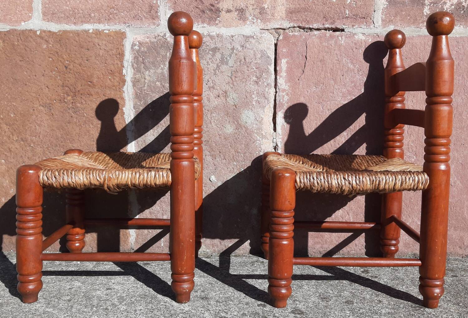 Pair of low armchairs by the fireplace. (Straw seat)