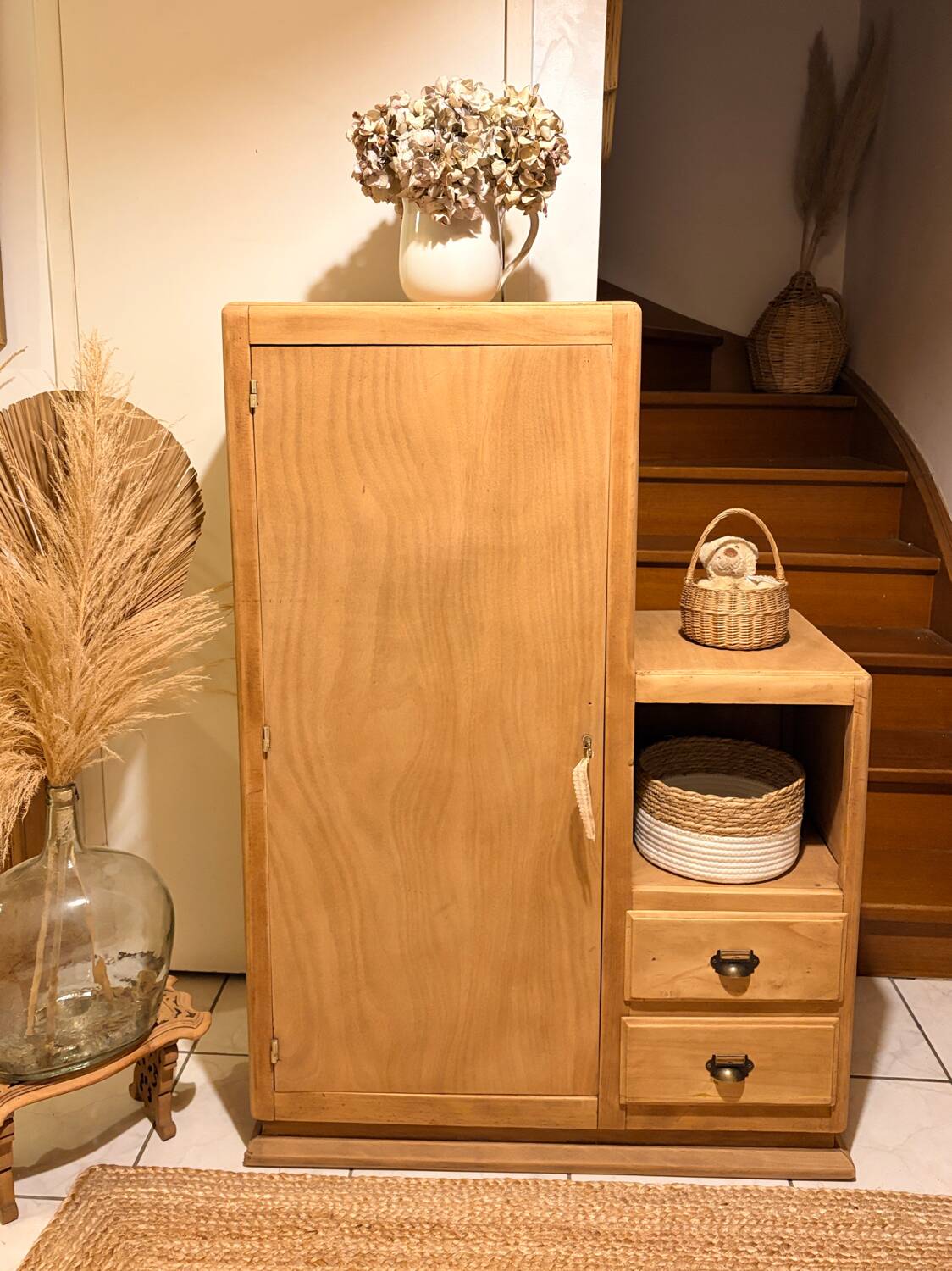 Asymmetrical cabinet made of raw wood