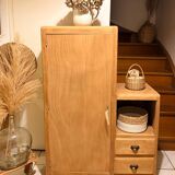 Asymmetrical cabinet made of raw wood