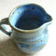 Vernified and flamed sandstone teapot, and its milk pot