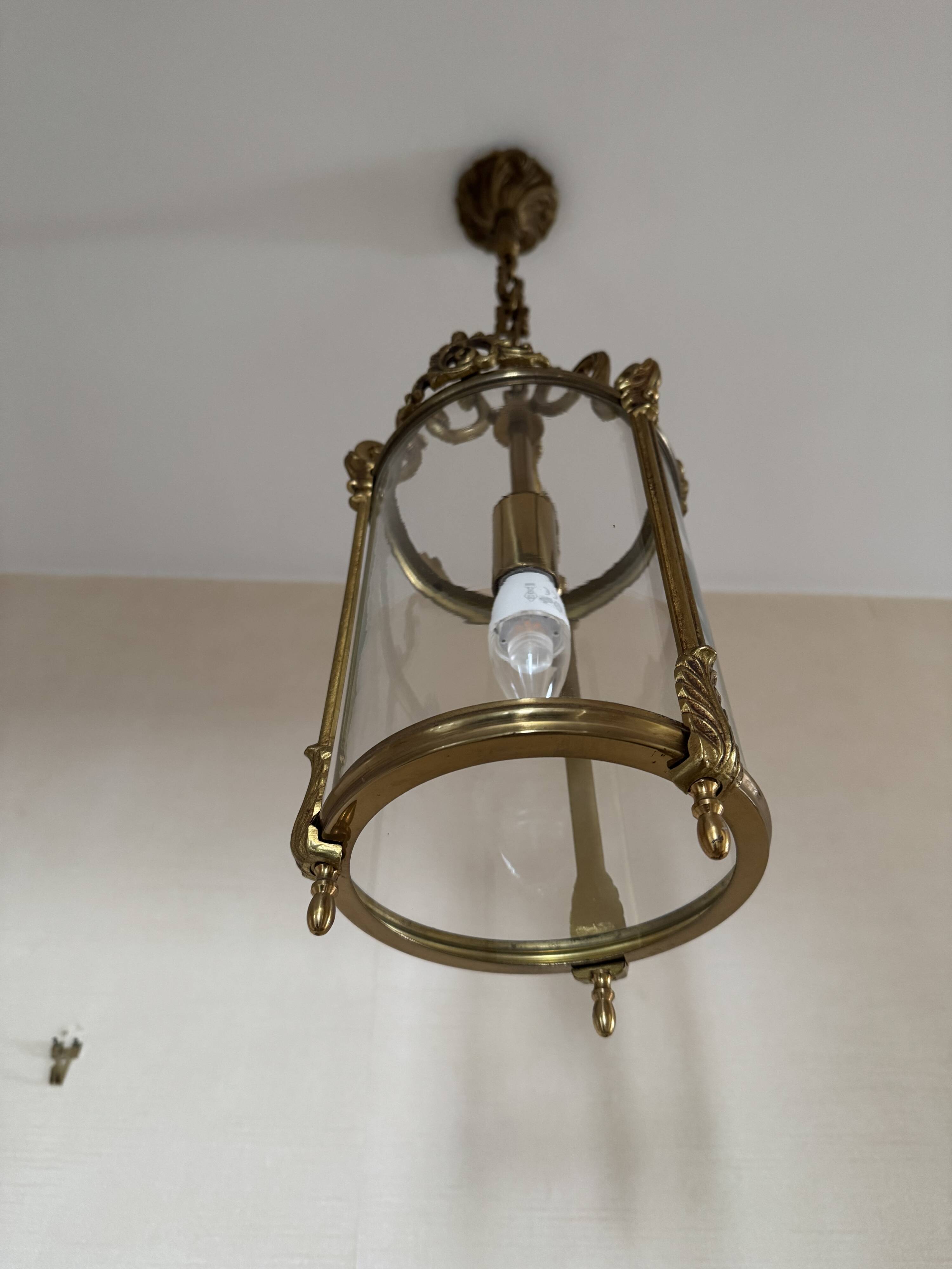 Golden hanging lantern and glass