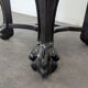 Side table with a wooden frame and marble top.