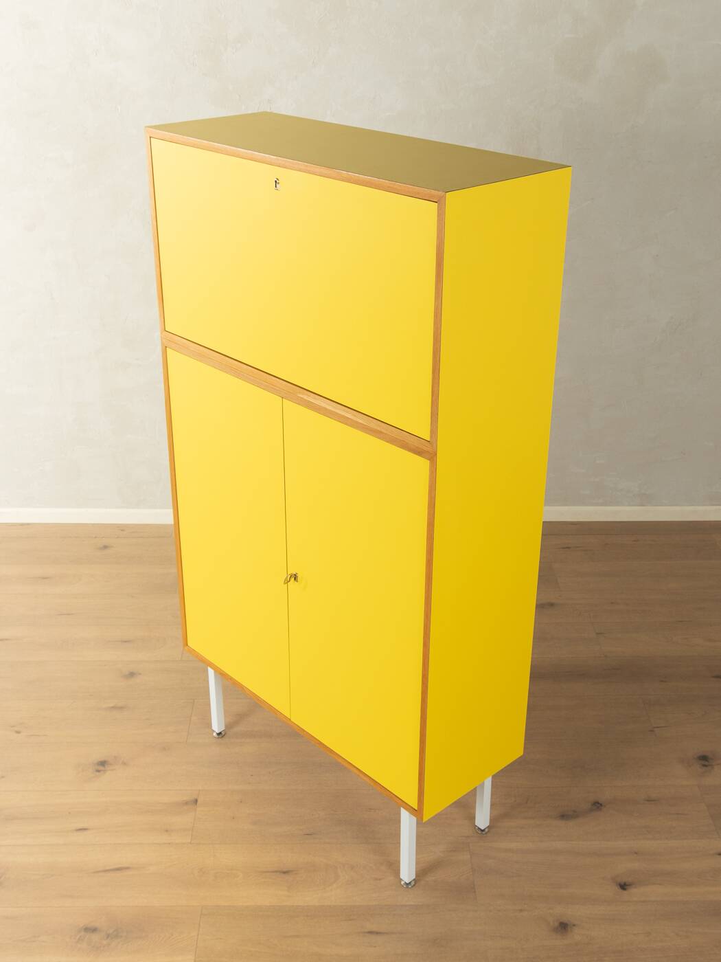 Classic sideboard from the 1960s, oak veneer, yellow Resopal, white steel feet