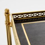 Pair of neoclassical side tables in brass and black leather by Maison Jansen, 1960.