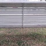Old garden bench with metal legs and wooden slats