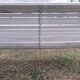 Old garden bench with metal legs and wooden slats