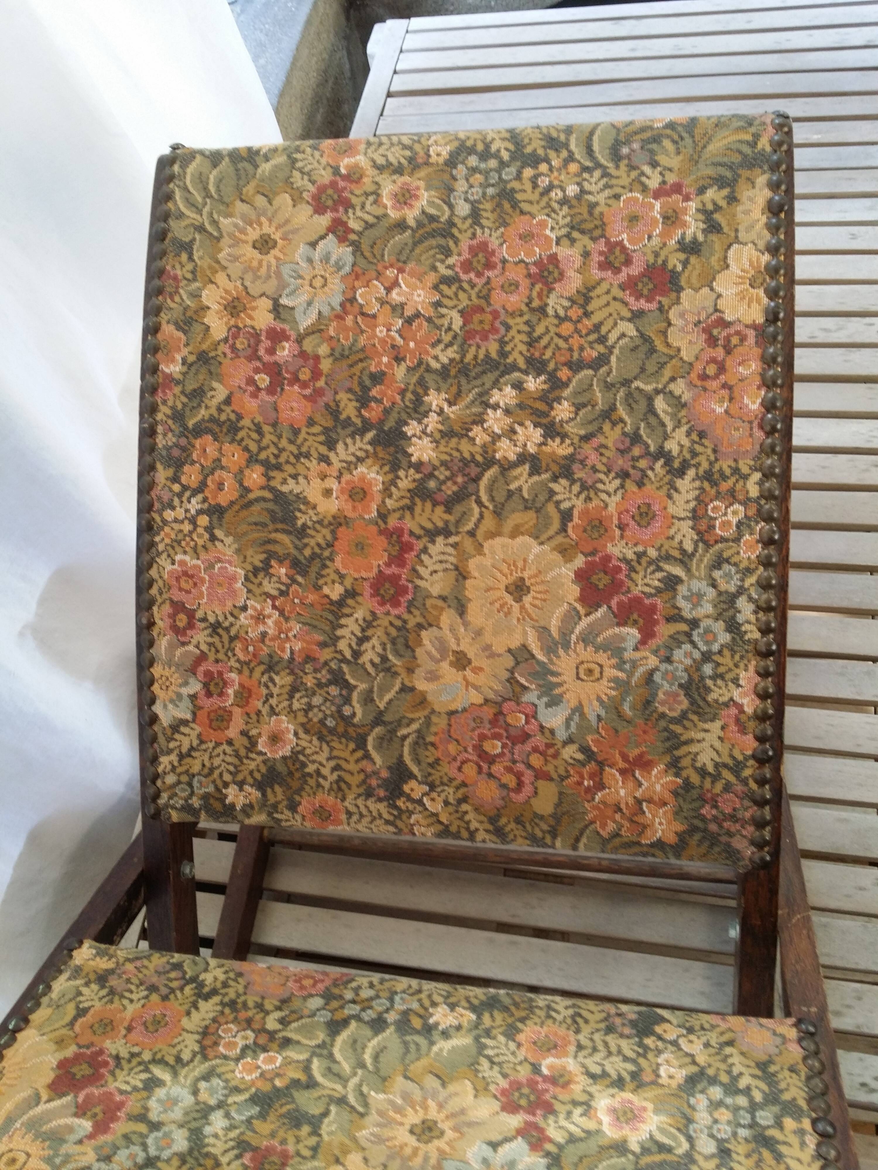 Wooden footrest and vintage tapestry