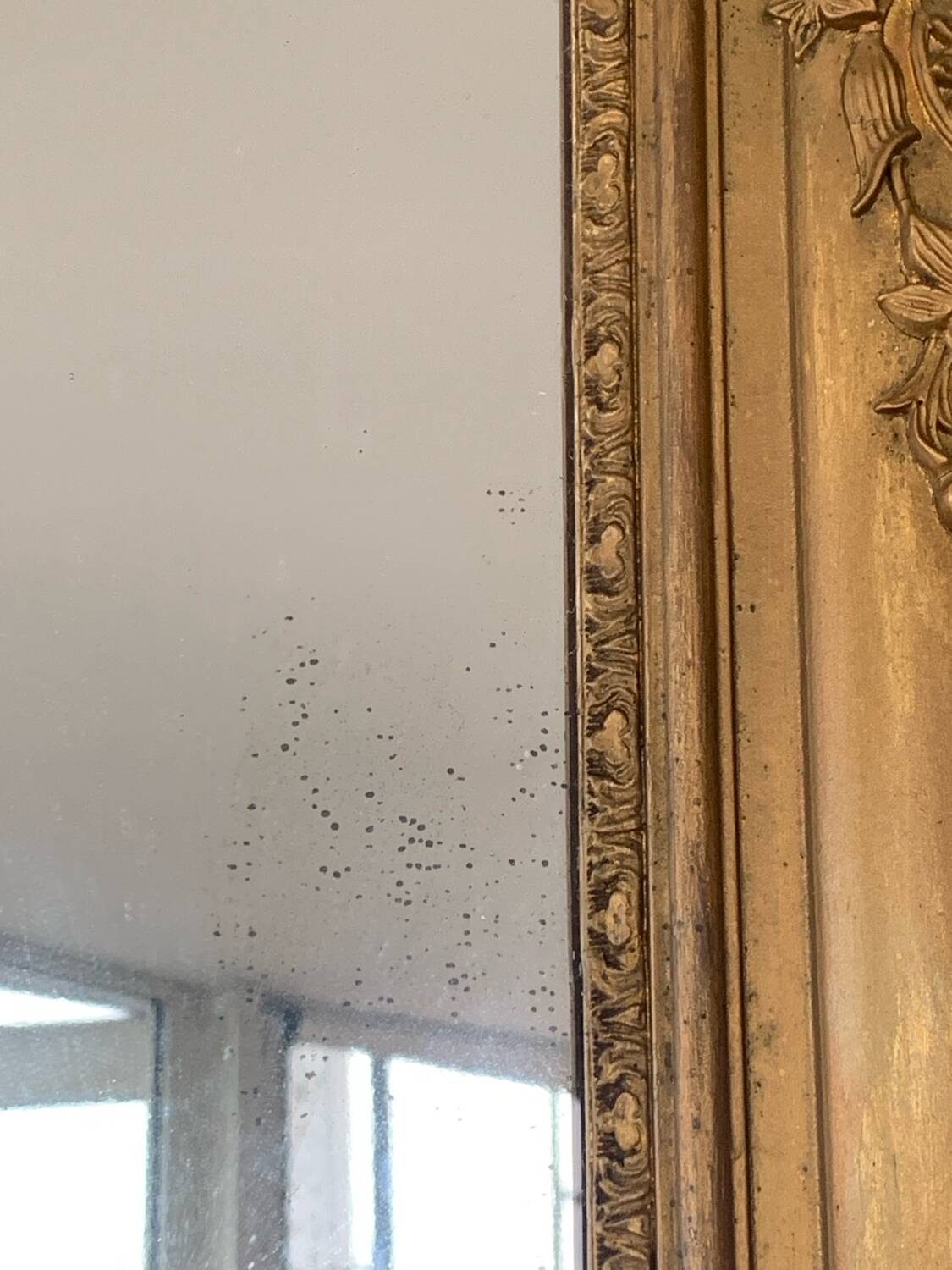 Old gilded mirror fireplace, 19th century restoration