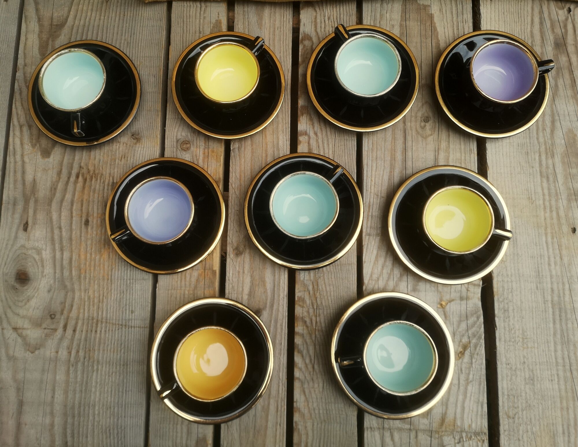 Set of 9 cups and sub-cups in black ceramic and colored gold border