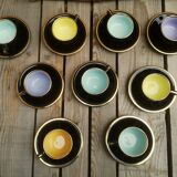 Set of 9 cups and sub-cups in black ceramic and colored gold border
