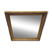 Small old mirror in wood and gilded stucco