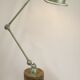 Jielde table lamp with 2 arms on a wooden base.