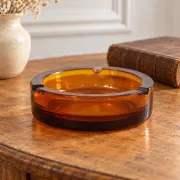 Vintage Italian round ashtray in thick amber glass – Ø 15 cm