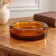 Vintage Italian round ashtray in thick amber glass – Ø 15 cm