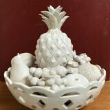 Trompe l'oeil fruit cut in white earthenware by Jean Roger, circa 1960.