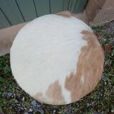 Antique tripod stool in wood and cowhide