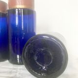 Suite of four bottles of ancient apothecary in blue breath glass