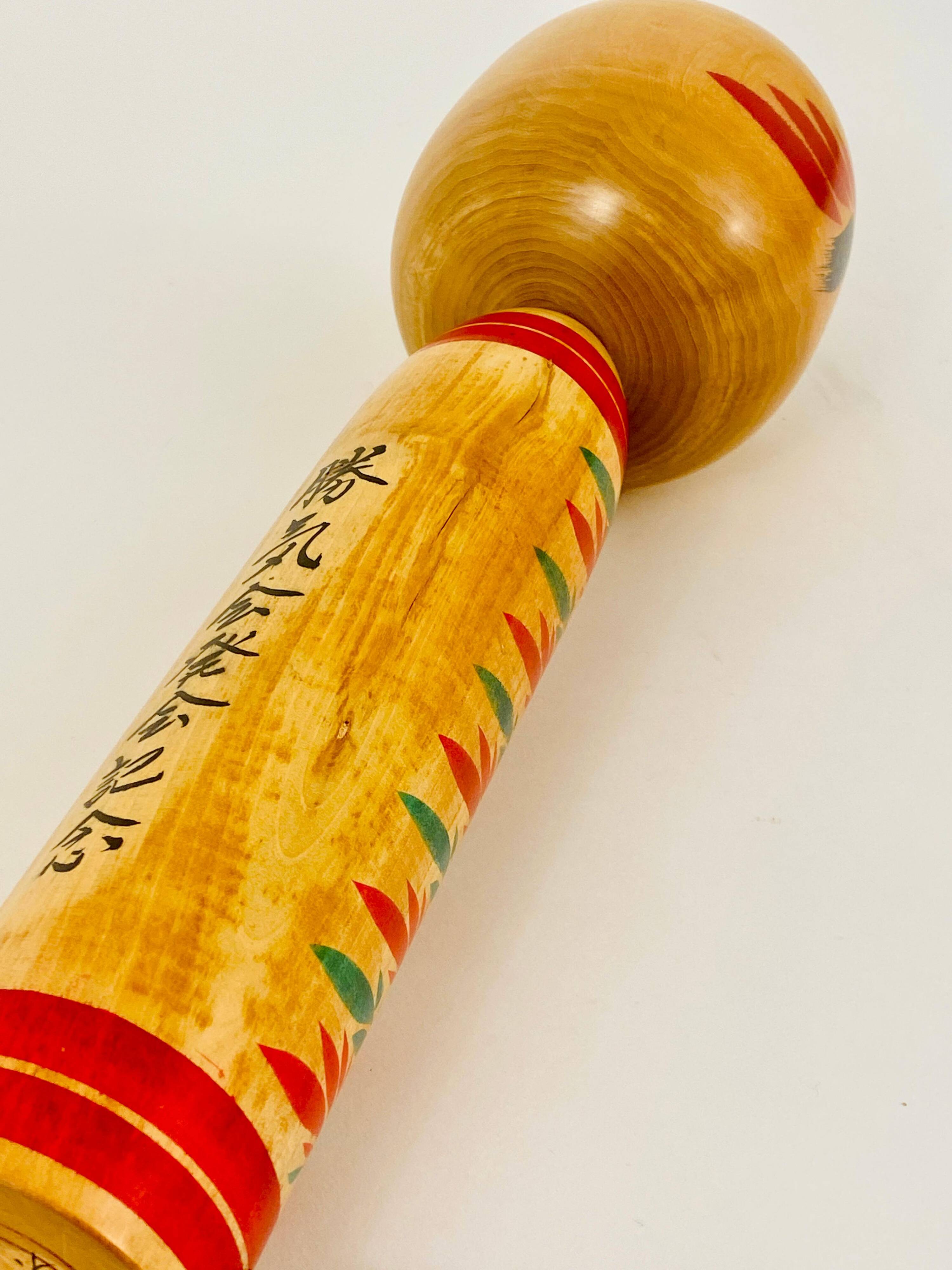 Decorative Togatta Kokeshi doll sculpture from northern Japan, hand-painted.
