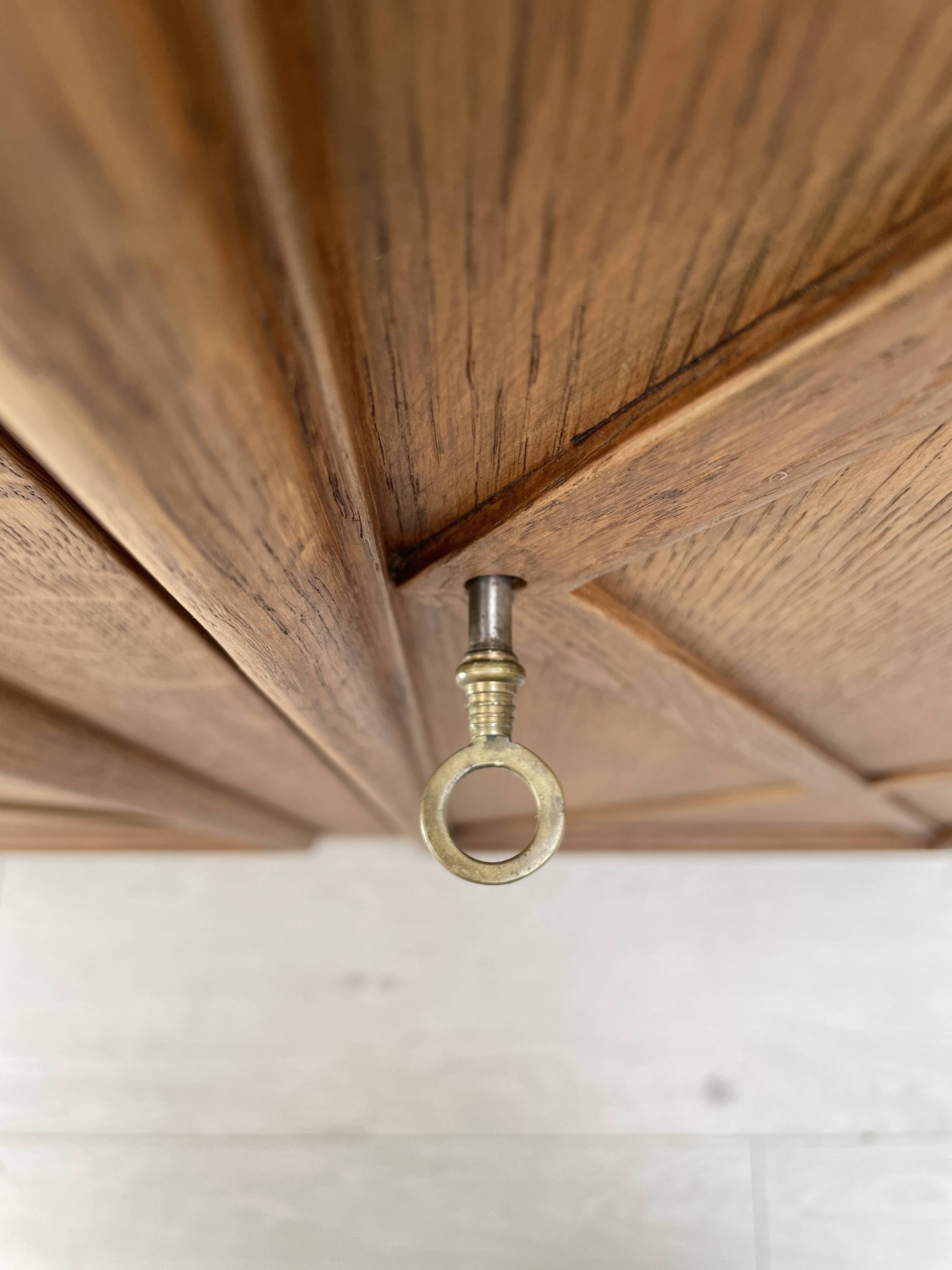 Storage unit in solid oak and veneer, circa 1960.
