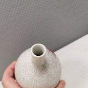 A vase in crackled porcelain with pink decoration. Germany 1930s