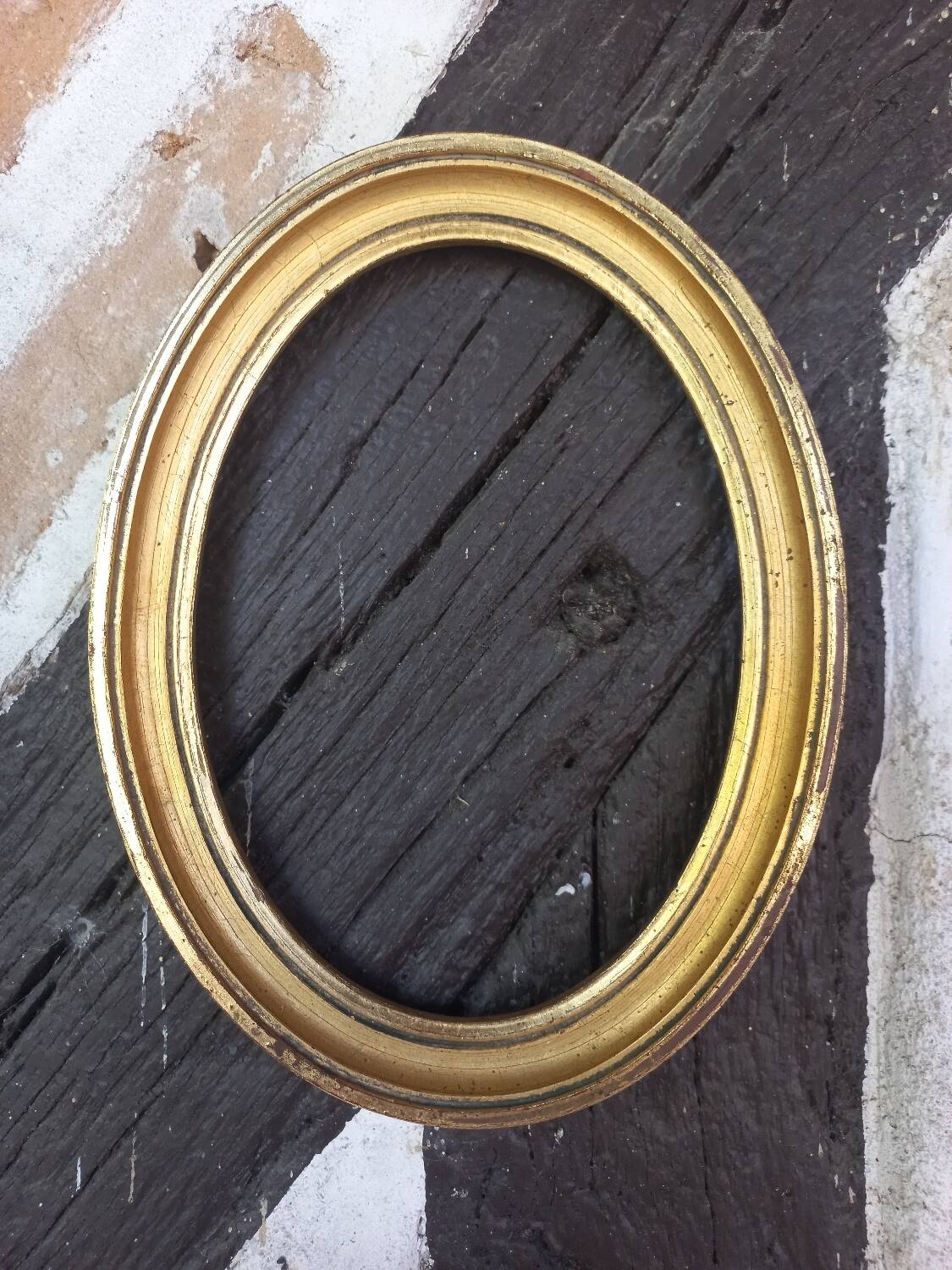 Golden oval frame