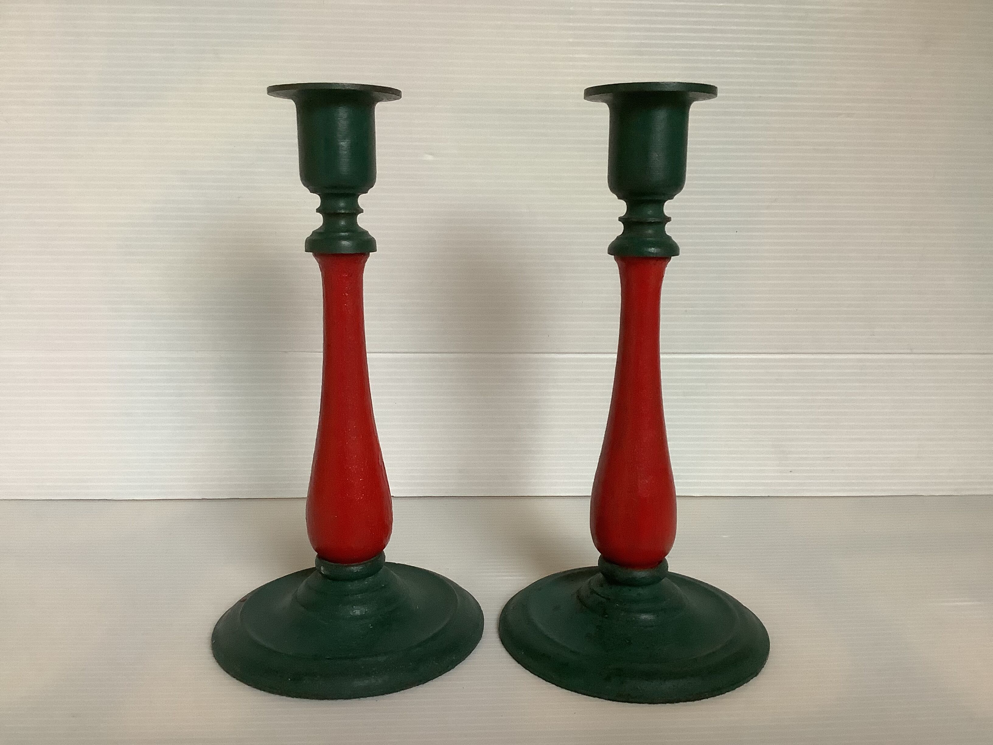 Pair of cast iron and wood candle holders