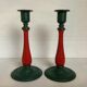 Pair of candlesticks in cast iron and wood