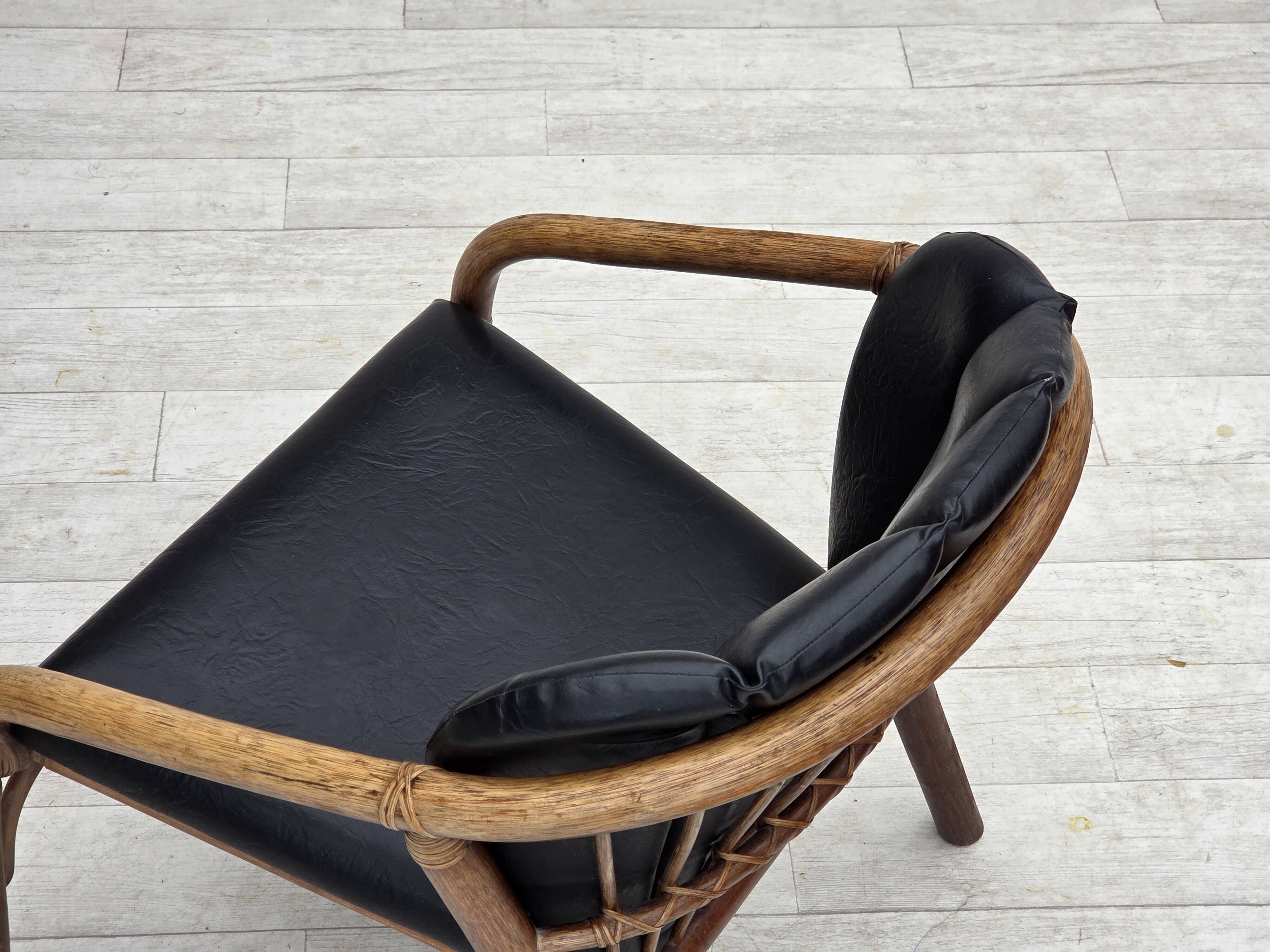 1970s, Danish armchair, rattan, black artificial leather.