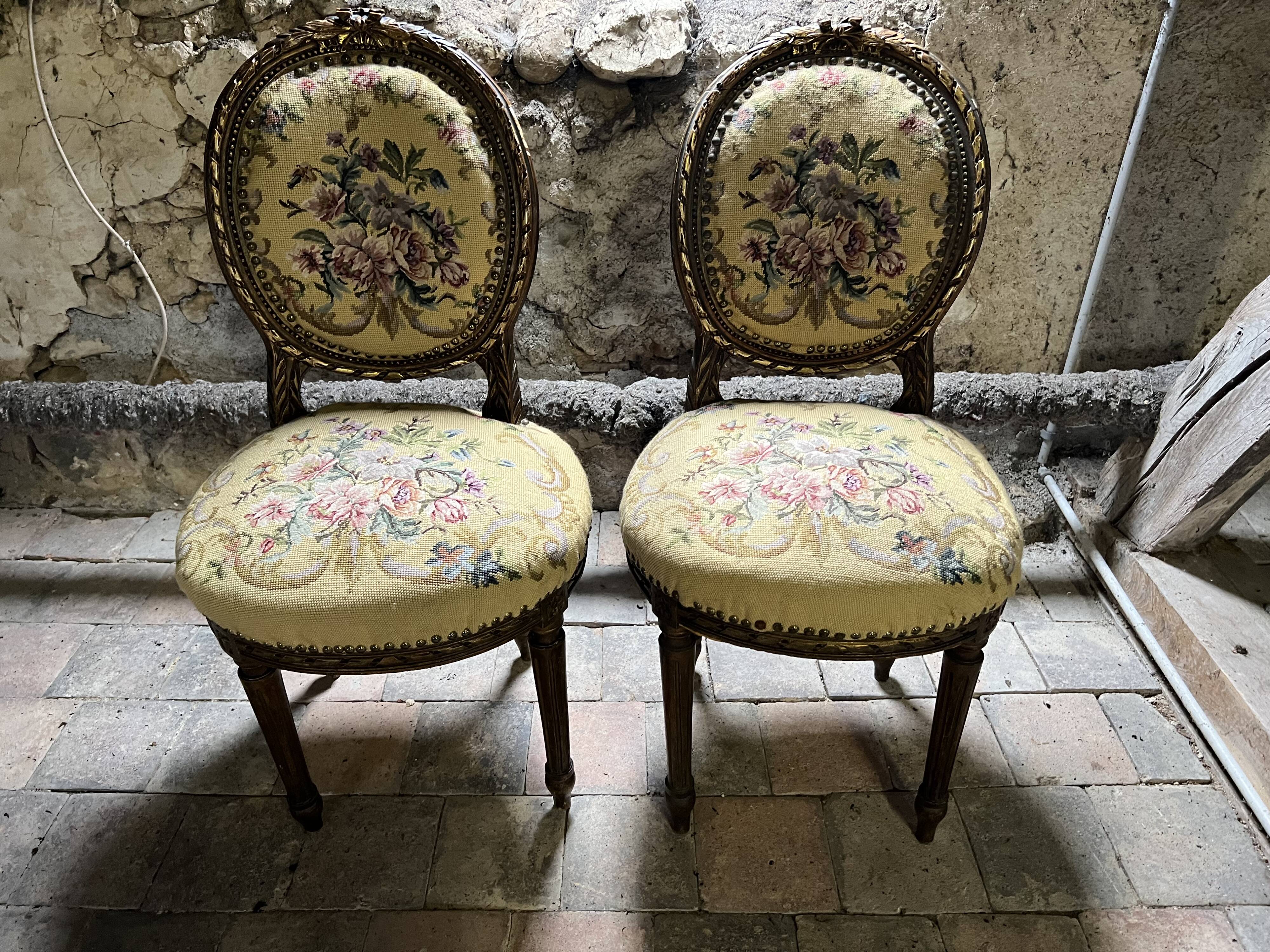 pretty pair of Louis XVI style chairs, in carved and gilded wood