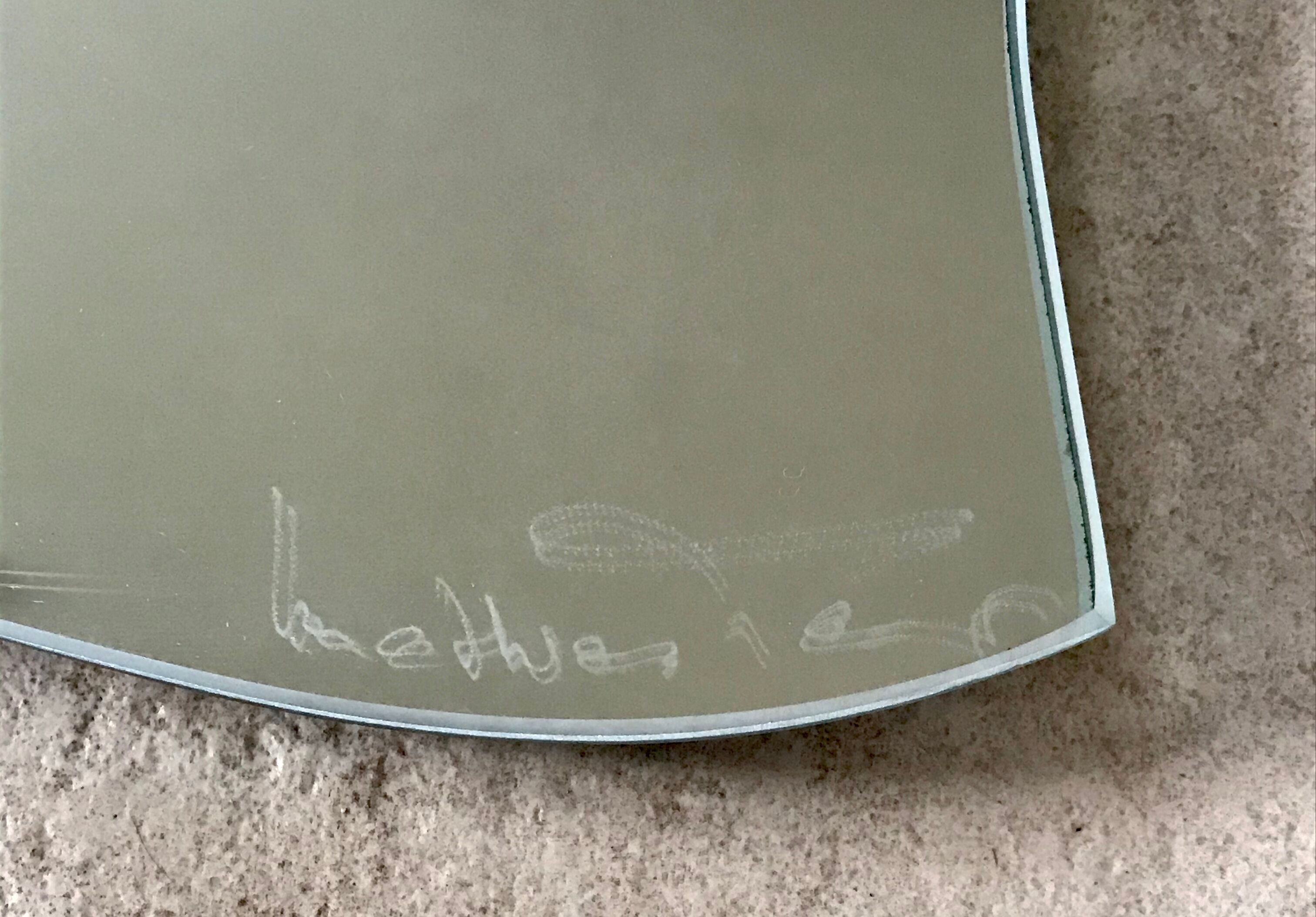 Free-form mirror signed Mathias 55x59cm