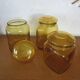 Ensemble de trois pots bocaux en verre jaune vintage
