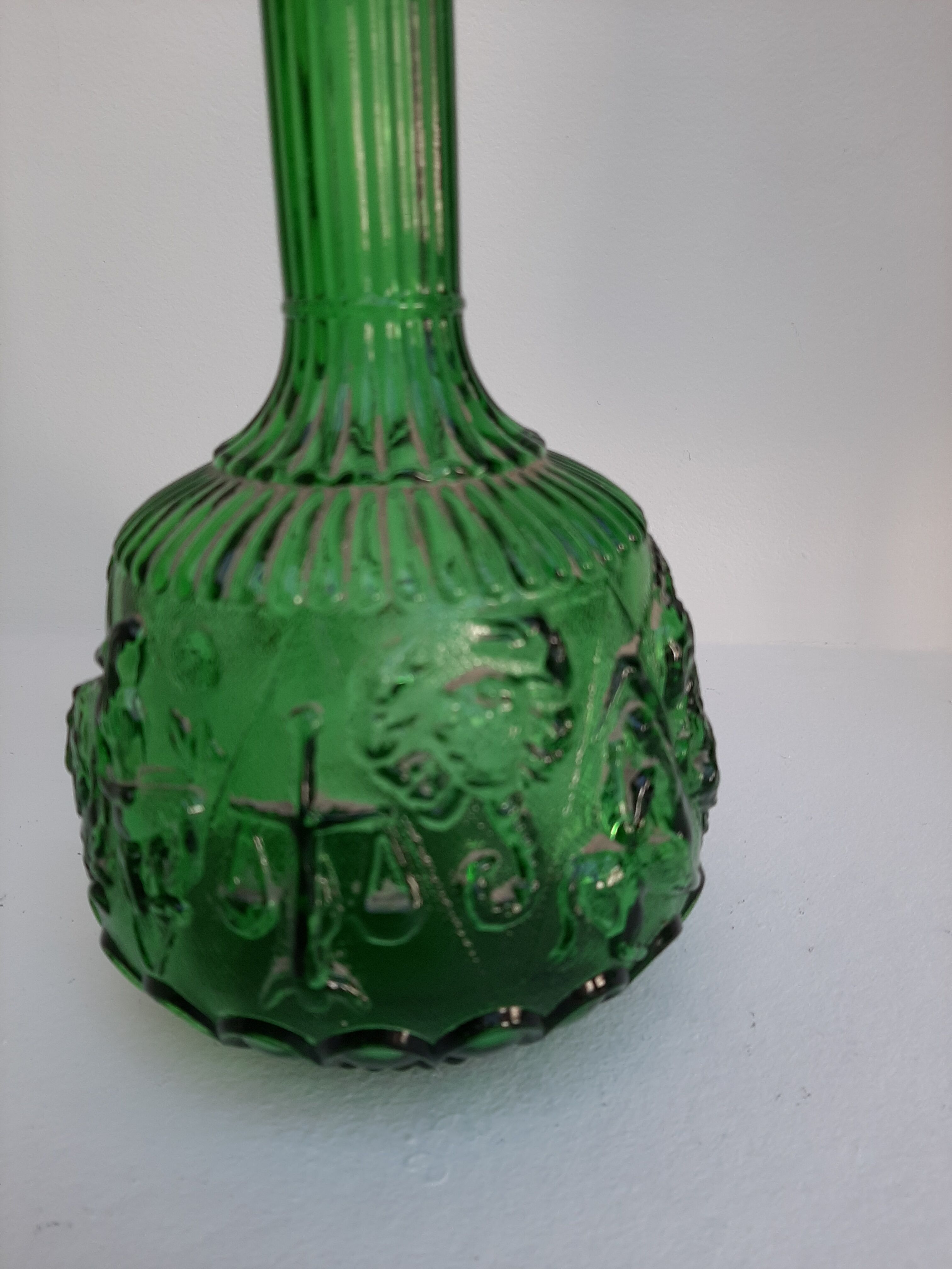 Empoli green glass bottle, zodiac signs