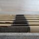 12 vintage stainless steel knives bone or bakelite sleeves in case
