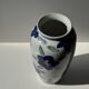 Vase white background stylized blue, yellow and green flowers H24.5 D12