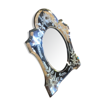 Old beveled Venetian mirror with engraved flower decoration