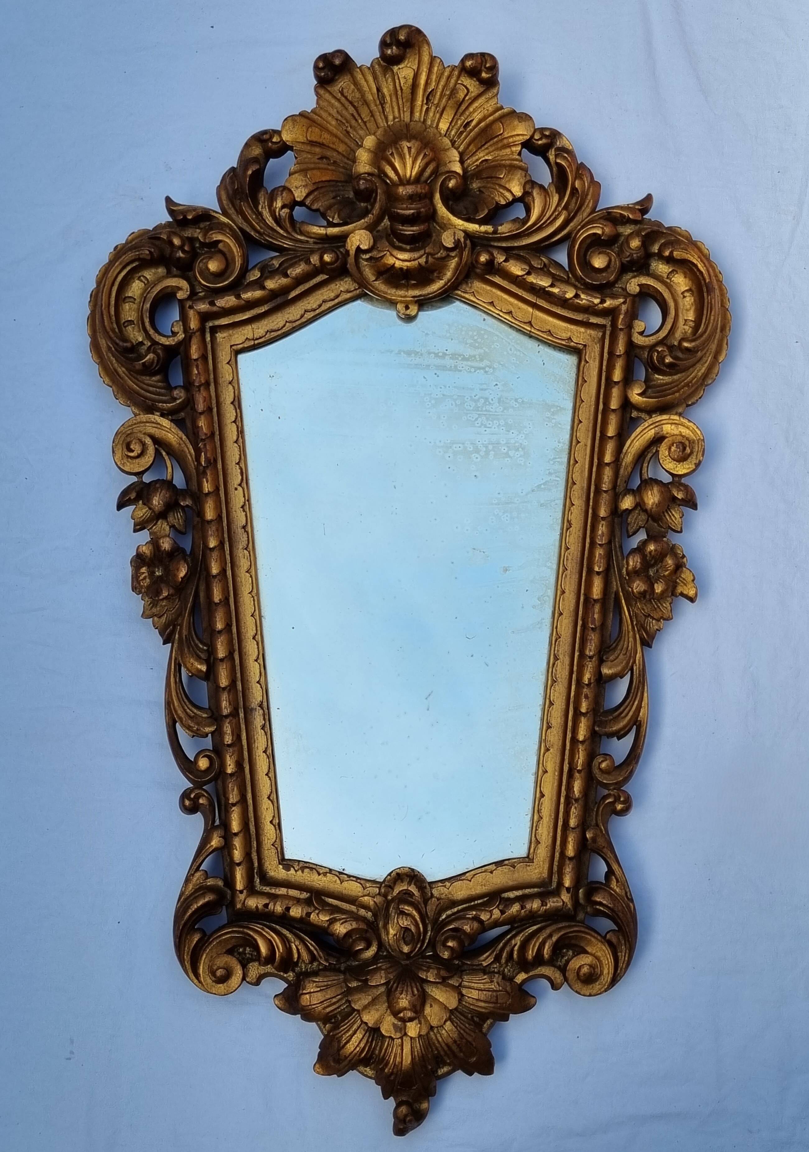 Antique wall mirror in carved gilded wood, Louis XV style, 19th century, 98 x 57 cm.