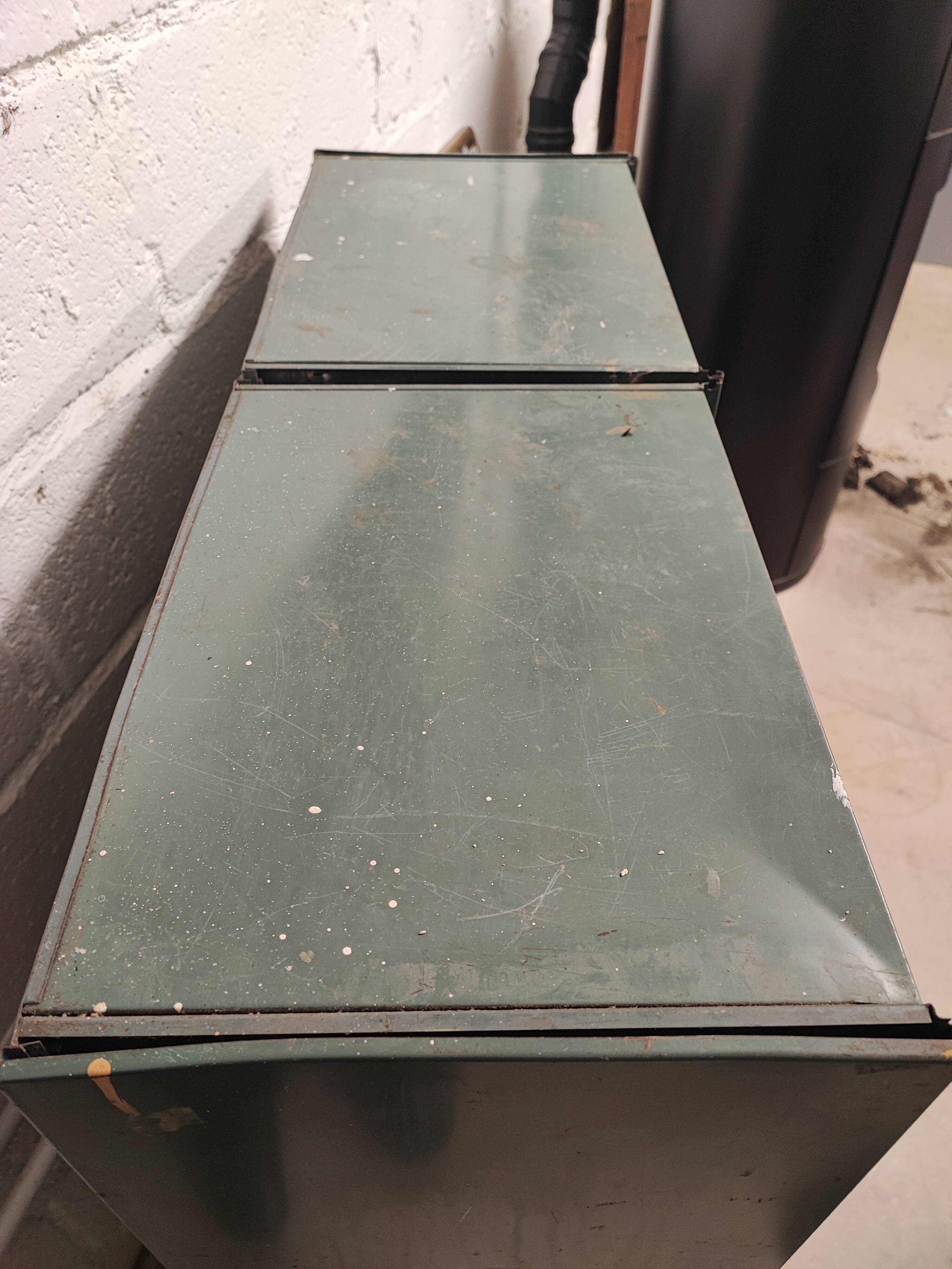 10-compartment metal locker with hinged door from the 50s