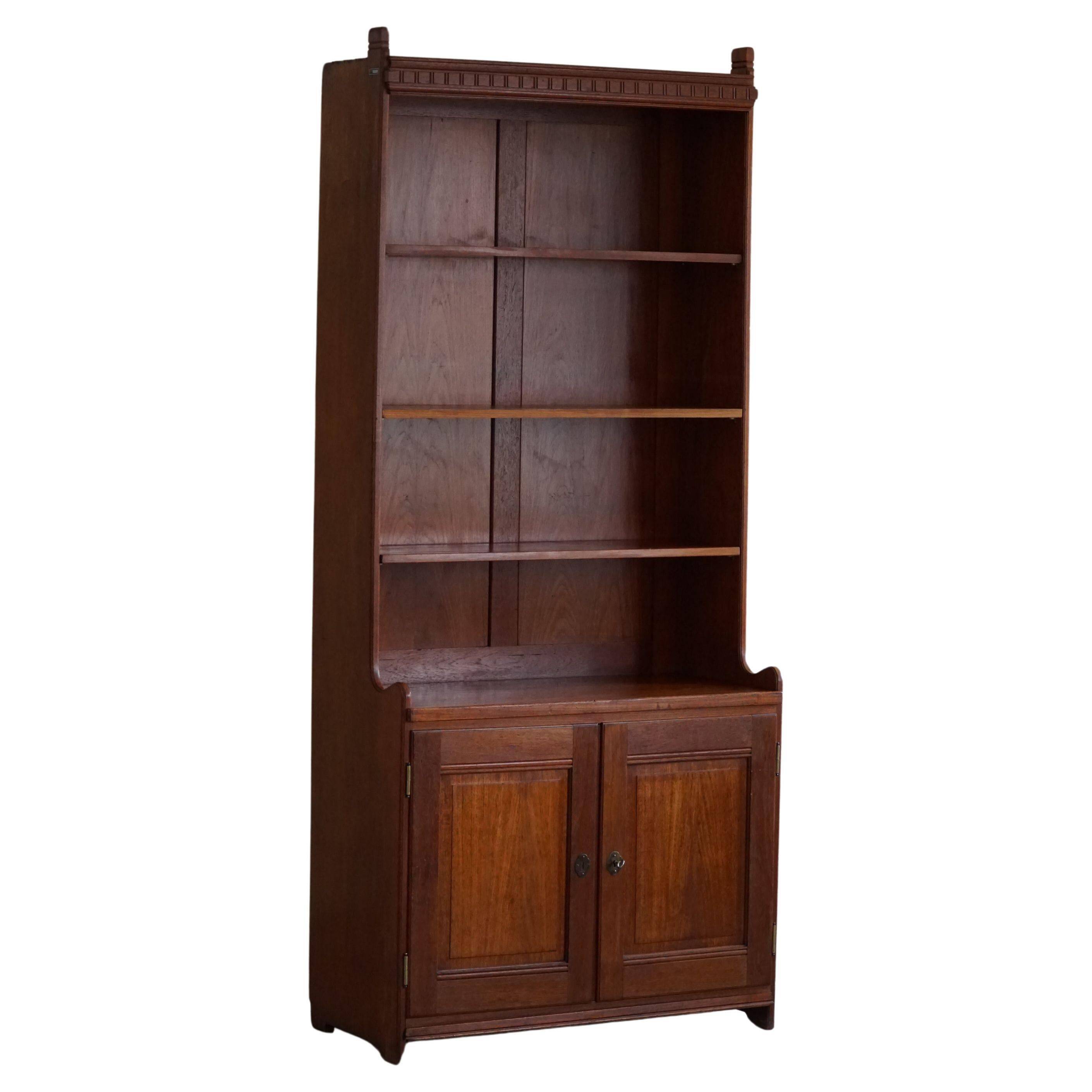 Rare high cabinet in teak by Martin Nyrop for Rud. Rasmussen, Denmark, early 20th century.
