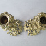 Pair of gilded bronze candlesticks with vine décor