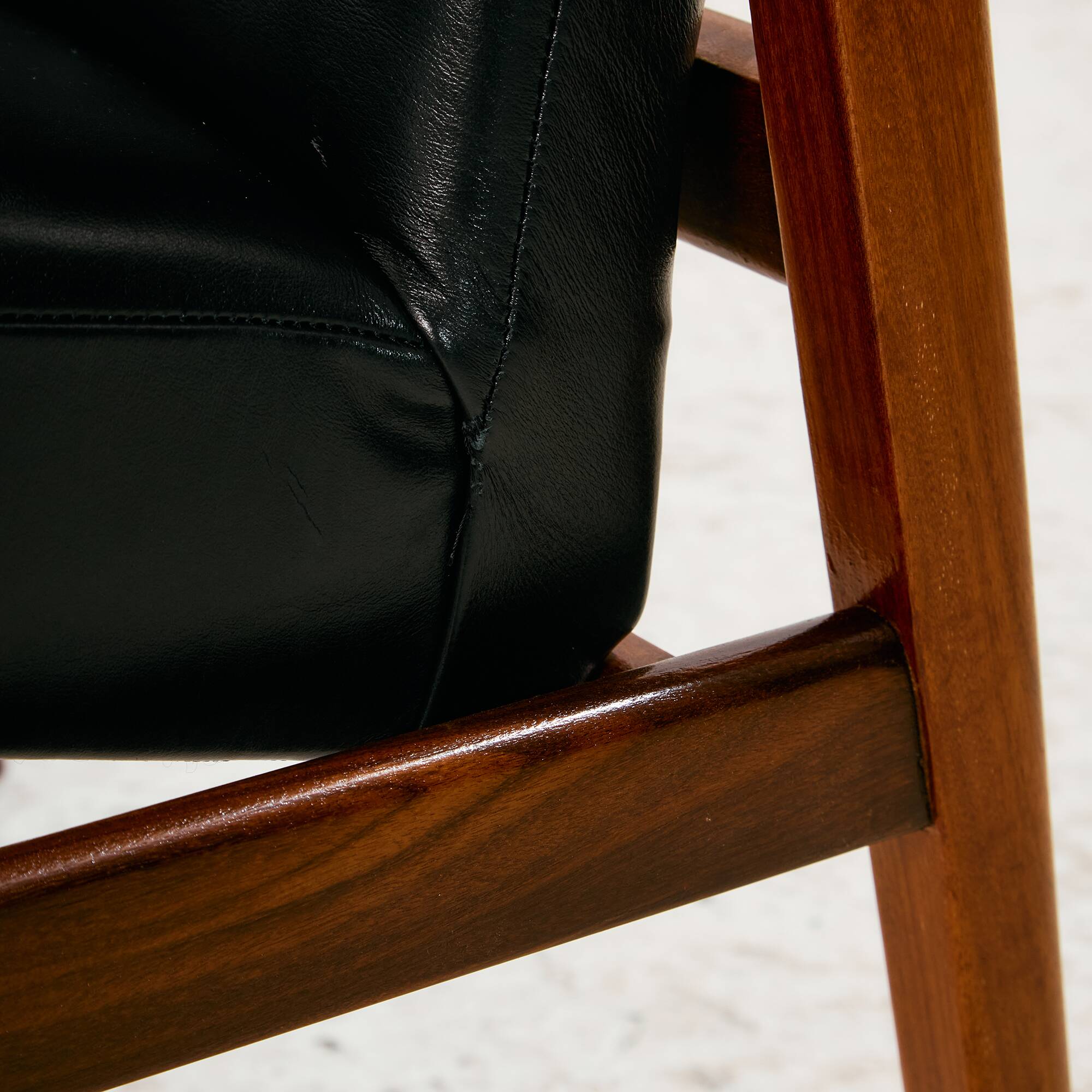 Teak armchair with leather upholstery