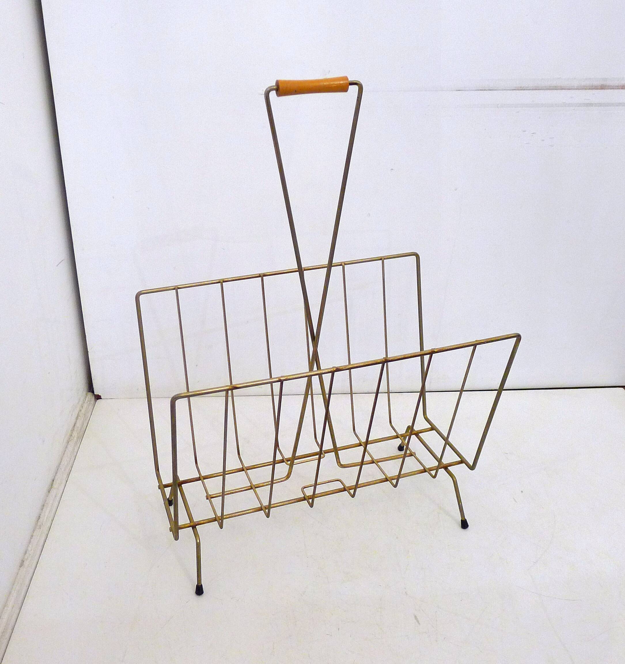 Mid-century openwork magazine rack, in gold metal & wooden handle.