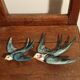 Set of two numbered vintage ceramic wall swallows