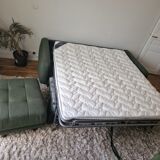 Green fabric sofa and its footrest/ottoman